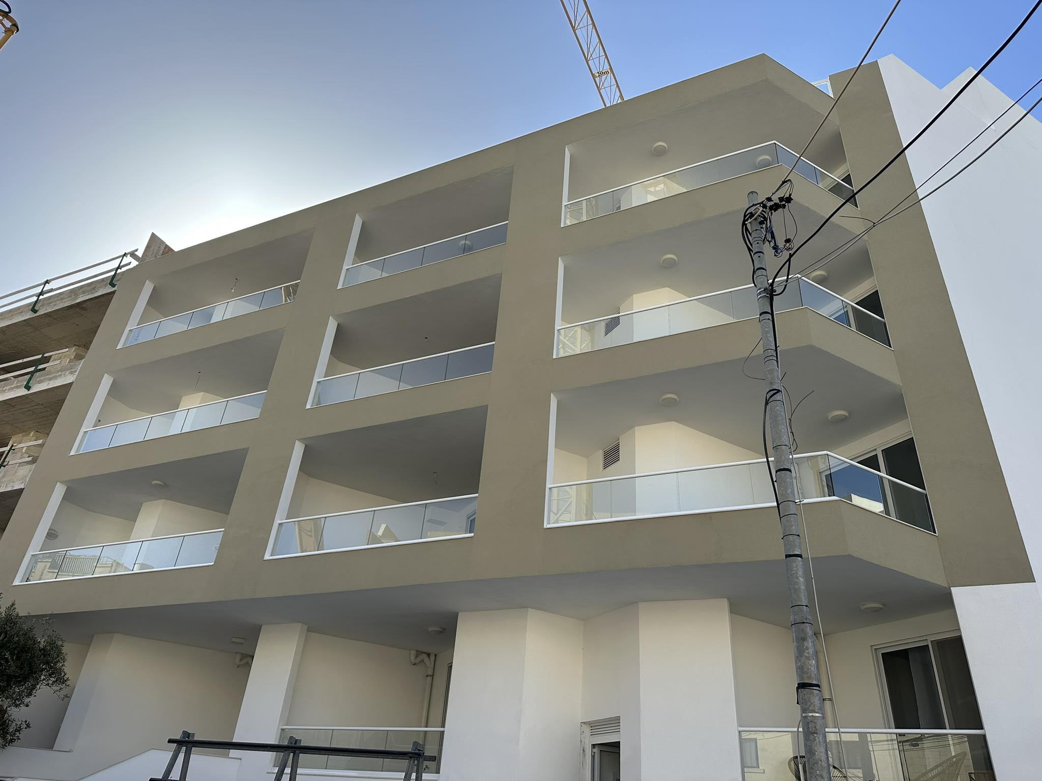 Apartment block with glass-balustrade balconies